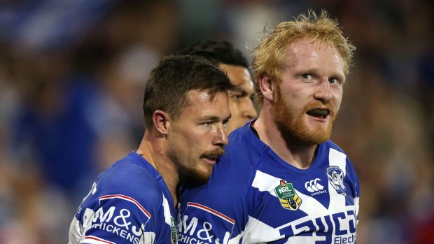 Bulldog spirit: James Graham with Damien Cook after a try during the round 25 win over the Newcastle Knights.