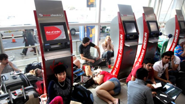 Hardware failure ... Virgin Blue passengers wait at Sydney Airport  yesterday. The problem affected travellers around the country.