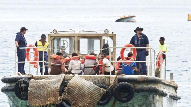 Asylum Seekers are transported to Christmas Island by barge.