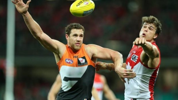 Ruck battle: Giants big man Shane Mumford and Swans counterpart Mike Pyke go head to head.