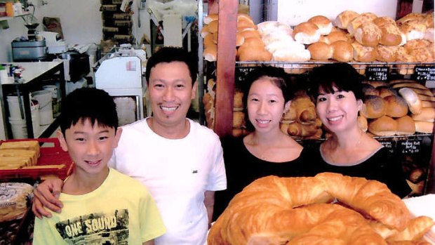 Local identities: Quan and Trinh Nguyen with their children Sophie and Kevin at the Vina Bakehouse in Wanniassa.