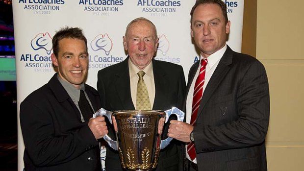 Hands on the prize ... Alistair Clarkson, John Kennedy snr and John Longmire on Tuesday night.