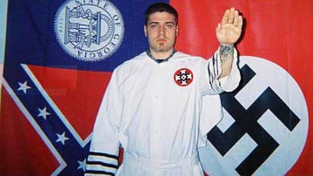 Facebook vandal Jarred Hensley in full Ku Klux Klan regalia.
