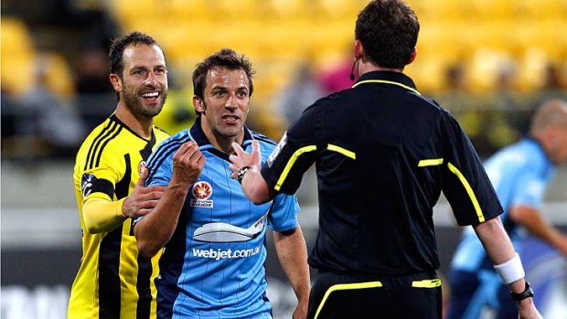 Making a point: Phoenix captain Andrew Durante restrains Sydney's Alessandro Del Piero.