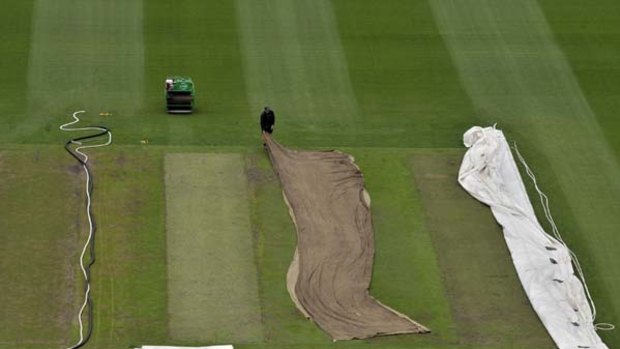 Roller decks ... groundsmen tend to the wicket at the MCG before the fourth Test.