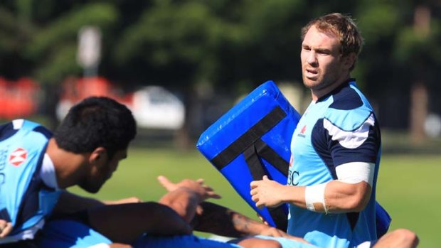 Getting down to it &#8230; Waratahs breakaway Rocky Elsom looks over the team's scrum at training yesterday. The NSW side will travel to Canberra to face the Brumbies, who lead the Australian conference.
