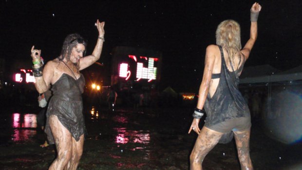 No stopping these party girl at a rain and mud saturated Future Music Festival.