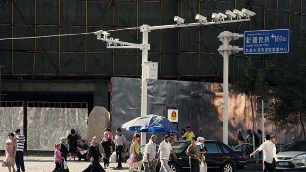 Surveillance cameras at a busy crossroad in Urumqi, China.