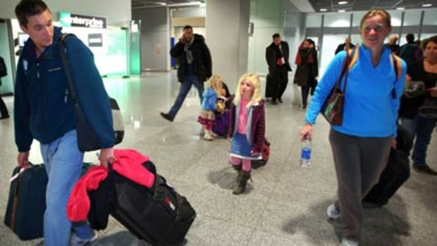 The Rogers family, Phil and Helen wih daughters Tamsyn, 4, and Alysha, 6 arrive in Frankfurt, Germany after being evacuated from Cairo.