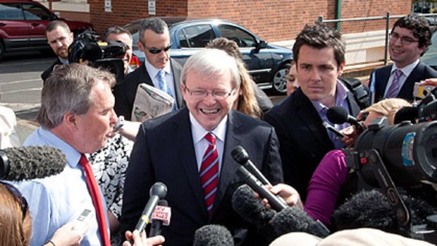 Kevin Rudd is the centre of media attention in Brisbane during his first day campaigning in the federal election last week.
