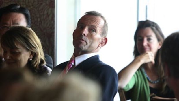 Man of the people? ... Tony Abbott at an International Women's Day event yesterday.