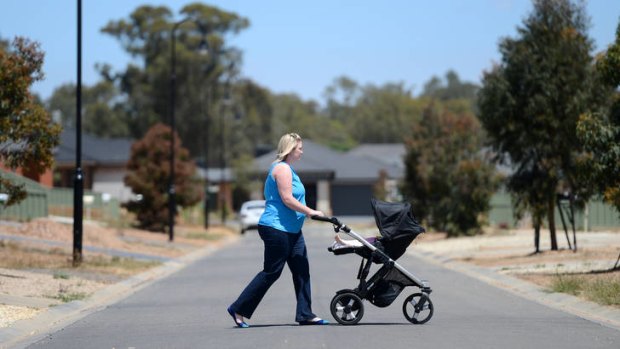 Aimee Ryan walks daughter Maddison through the Maiden Gully estate, where she and husband David recently built a house.