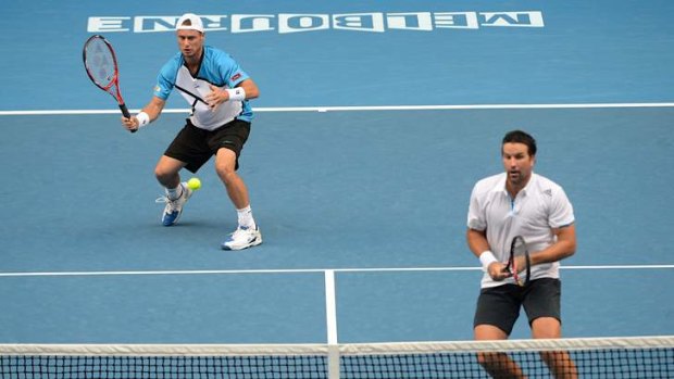 Winding back the years: Pat Rafter and Lleyton Hewitt joined forces in the men's doubles.
