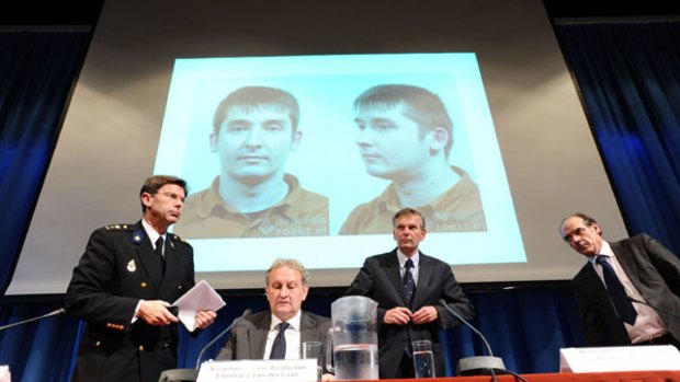 Police at a news conference display a picture of the man arrested on suspicion of sexual abuse on up to 50 children.