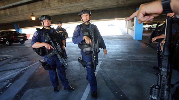 Aftermath: SWAT officers conduct a security check at LAX after the shooting rampage.