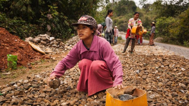 Rai Seng, 13, works for 4000 kyat (US$3.3) per day building and repairing roads in Kachin State, Myanmar.