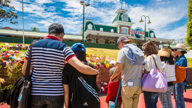 A family on holiday on the Gold Coast arrives to closed doors at Dreamworld, where four people died after a malfunction with the Thunder River Rapids ride.