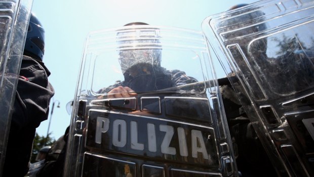 ROME - JULY 07:  Italian riot police stand guard during a demonstration near the Sapienza university prior to the arrival of the world G8 leaders for their summit on July 7, 2009, Rome, Italy. World leaders attending the G8 summit are expected to discuss tackling world hunger and the global reduction of greenhouse gases.  (Photo by Miguel Villagran/Getty Images)