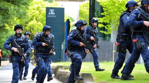 Police during raid exercise at Melbourne University on Sunday.