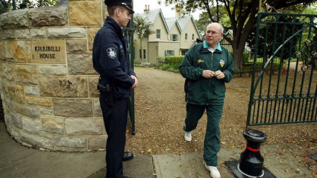 At his local: Then prime minister John Howard leaving Kirribilli House for his morning walk in 2004.