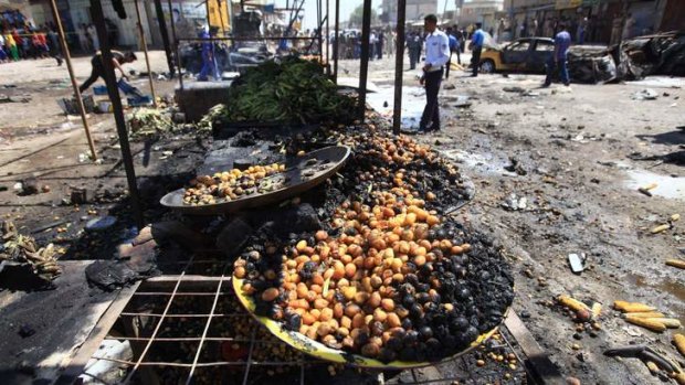 Shiite-dominated cities targeted: The site of a car bomb attack at a vegetable market in Basra, 550 kilometres southeast of Baghdad.