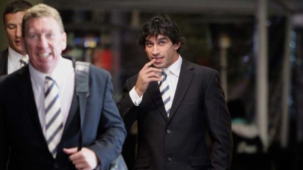 Good to go ... North Queensland footballer manager Peter Parr, left, and playmaker Johnathan Thurston at the judiciary hearing last night. Thurston is free to play in Origin III.