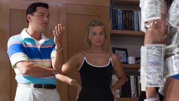 Irredeemable: Leonardo DiCaprio and Margot Robbie live large as Jordan Belfort and his wife.