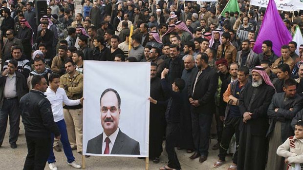 Protesters in response to arrests ... Iraq's Finance Minister Rafia al-Issawi's bodyguards have been detained for terrorist activity.