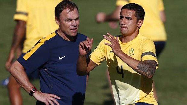 ''I will really have some headaches - but positive ones'': Socceroos coach Holger Osieck puts Tim Cahill through his paces.