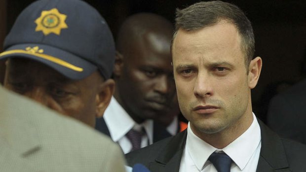 Oscar Pistorius leaves court after another dramatic day.