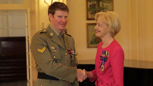 Governor-General Quentin Bryce presents Corporal Keighran with the Victoria Cross.
