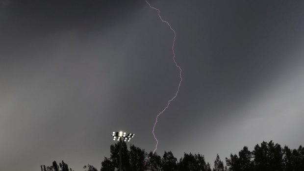Electric atmosphere: Lightning strikes during the Kerber-Safarova match at Sydney Olympic Park.