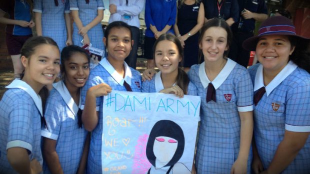 Students at John Paul College wait for Dami Im to arrive.