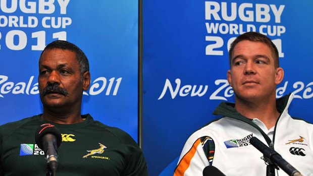 Springbok captain John Smit (R) and his head coach Peter de Villiers speak to the media in Wellington.
