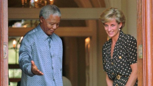 Nelson Mandela, left, escorts Diana, Princess of Wales, during a visit to Cape Town.