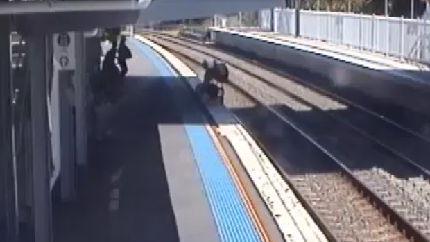 The pram tumbles on to the tracks at West Ryde station in Sydney's north.