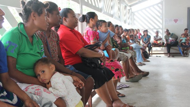 A woman attends a family planning clinic at Port Moresby General Hospital. The weekly clinic is frequently full to capacity, seeing up to 80 women, and offers family planning advice and health screening including pap smears.