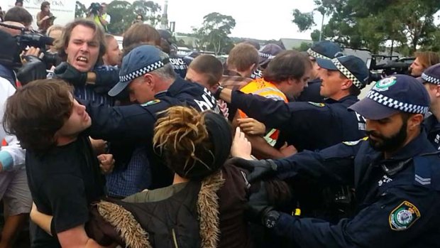 Police and protesters clash outside the Villawood detention centre.