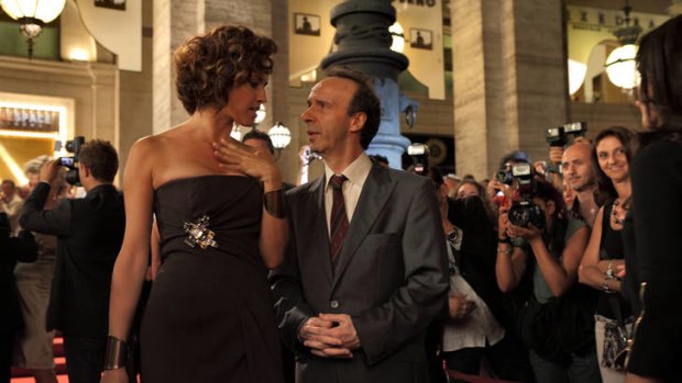 Roberto Benigni finds himself the centre of attention.