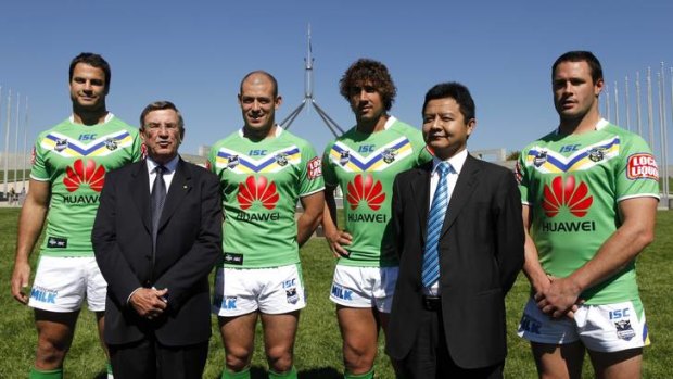John Lord (left) and David Wang with the Canberra Raiders for the new sponsorship for Canberra Raiders