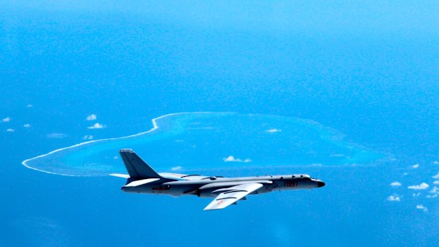 A Chinese H-6K bomber patrols the islands and reefs in the South China Sea.