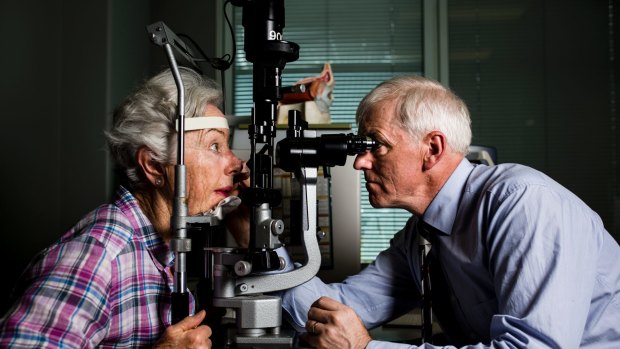 Optometrist Dr Mark Feltham with patient Patricia White of Bruce. The ACT has a shortage of new optometrists, according to the federal government. Photo: Jamila Toderas.