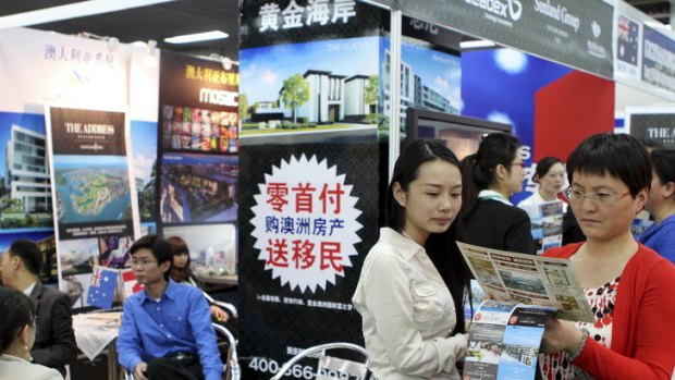 Investors at an Australian booth at Beijing international property fair.
