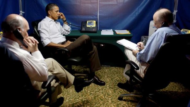 President Barack Obama is briefed on the uprising in Libya during a conference call inside a secure tent setup near his hotel suite in Rio de Janeiro, 2011.