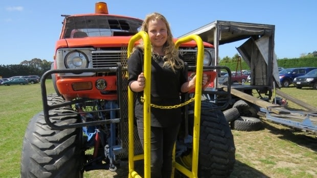 Tori Giles, 13, was driven through four fire walls in a metal cage attached to a monster truck at a show in New Zealand.