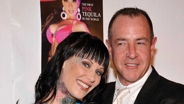 Charged ... Lindsay Lohan's father, Michael Lohan, parties with Michelle 'Bombshell' McGee.