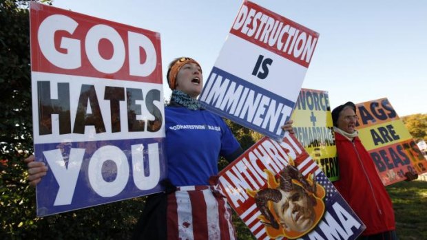 Members of the Westboro Baptist Church hold anti-gay signs at a previous protest.