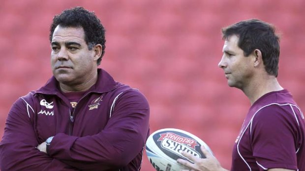 Focused ...  Mal Meninga and former Maroons player Mark Coyne watch on during a training session at Suncorp Stadium last month.