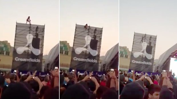 An unidentified man falls from scaffolding during a DJ set at Sydney's Creamfields concert.