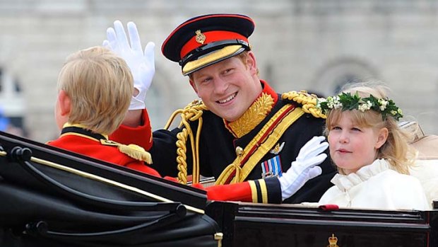 Prince Harry waves after his brother's wedding.